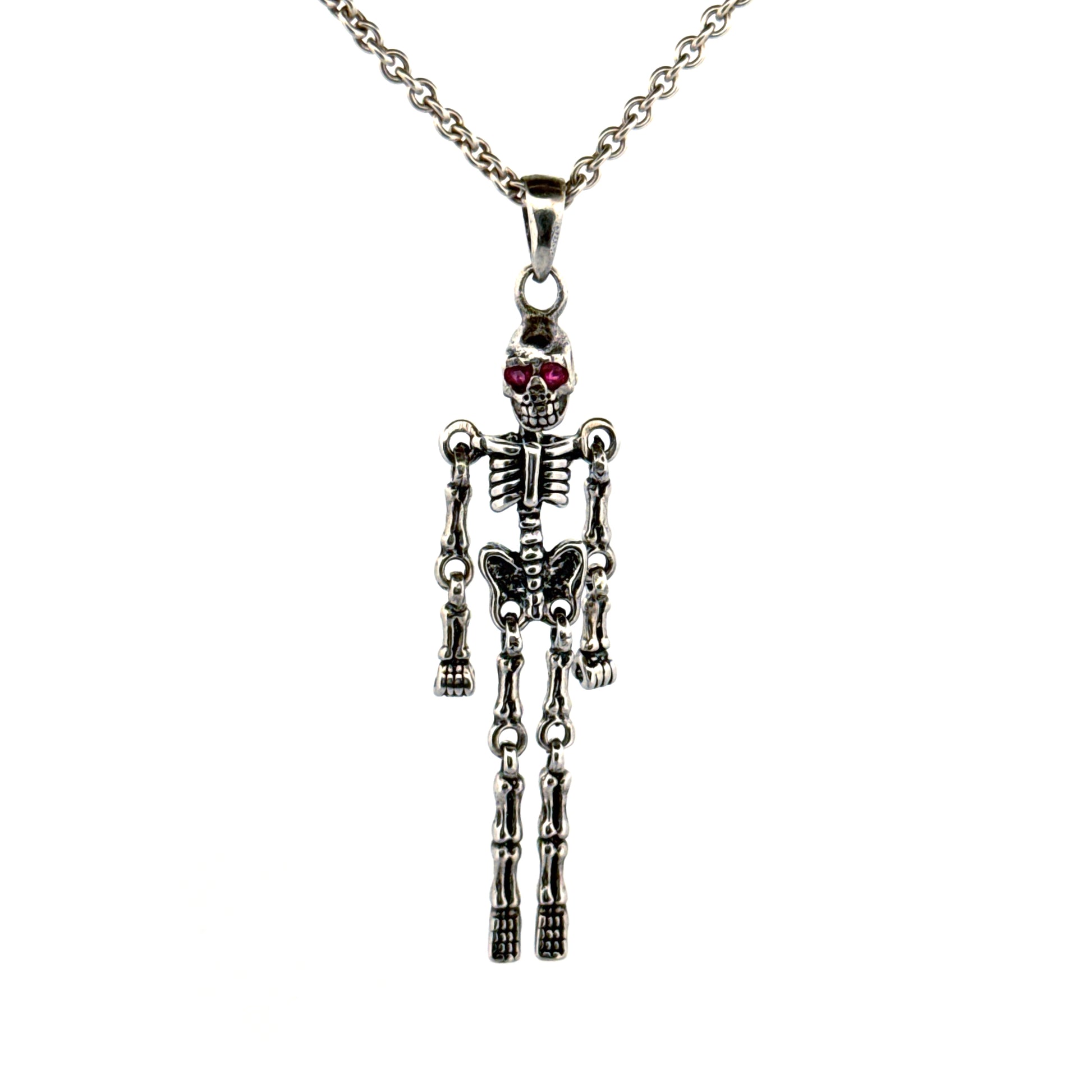 Sterling silver skeleton pendant with ruby eyes by Daniel Lilliestierna
