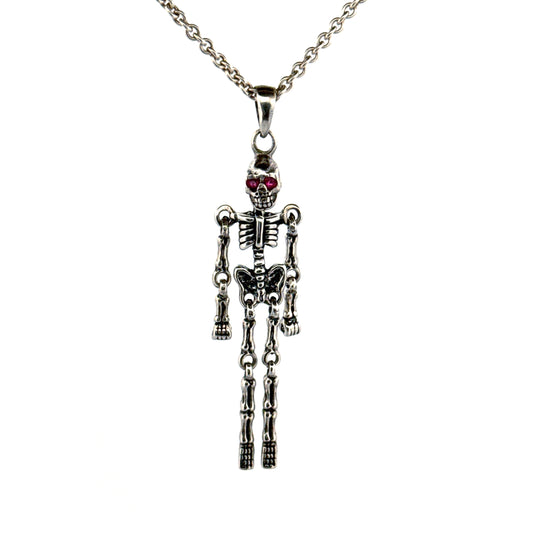 Sterling silver skeleton pendant with ruby eyes by Daniel Lilliestierna